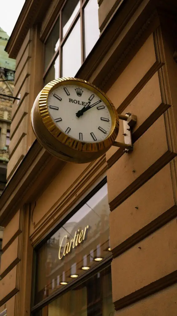 Vintage Rolex Wall Clock on Historic Building